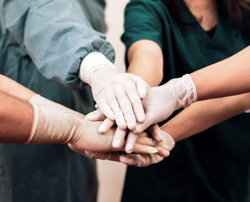 Group of surgeons shaking hands
