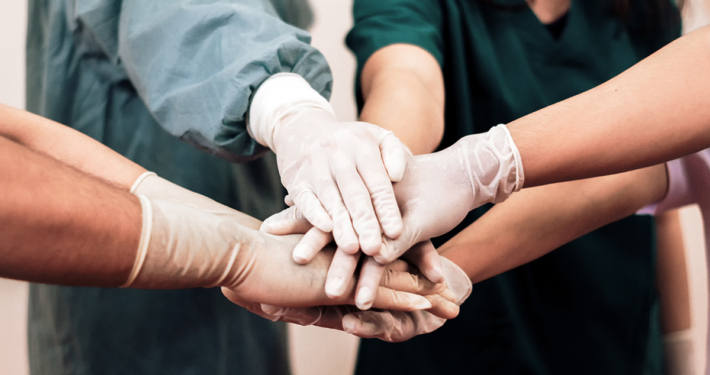 Group of surgeons shaking hands